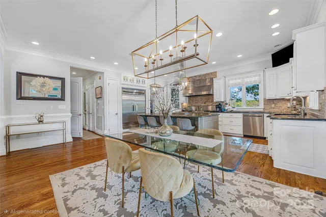 a large kitchen with a table and chairs in it