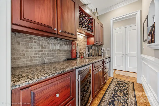 a kitchen with granite countertop wooden cabinets and a sink