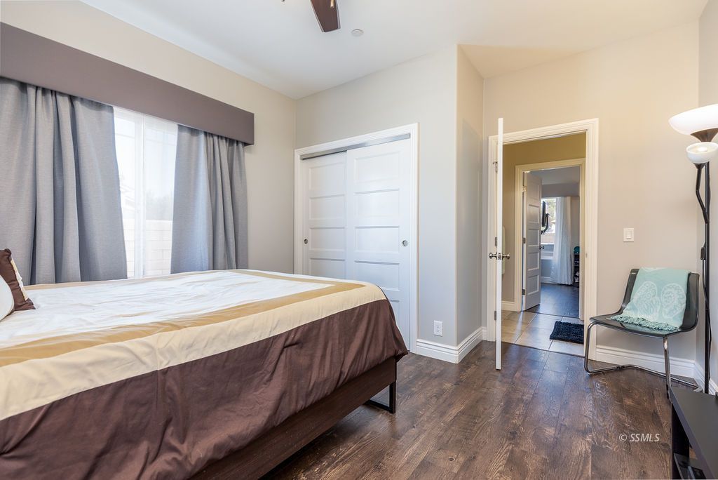 1030 Arroyo Street Ridgecrest, CA 93555 - Photo 28 of 49 a bedroom with a bed and a chair