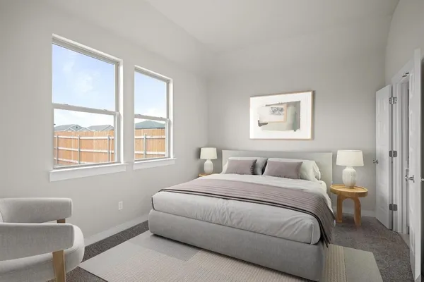a bedroom with a bed and a couch