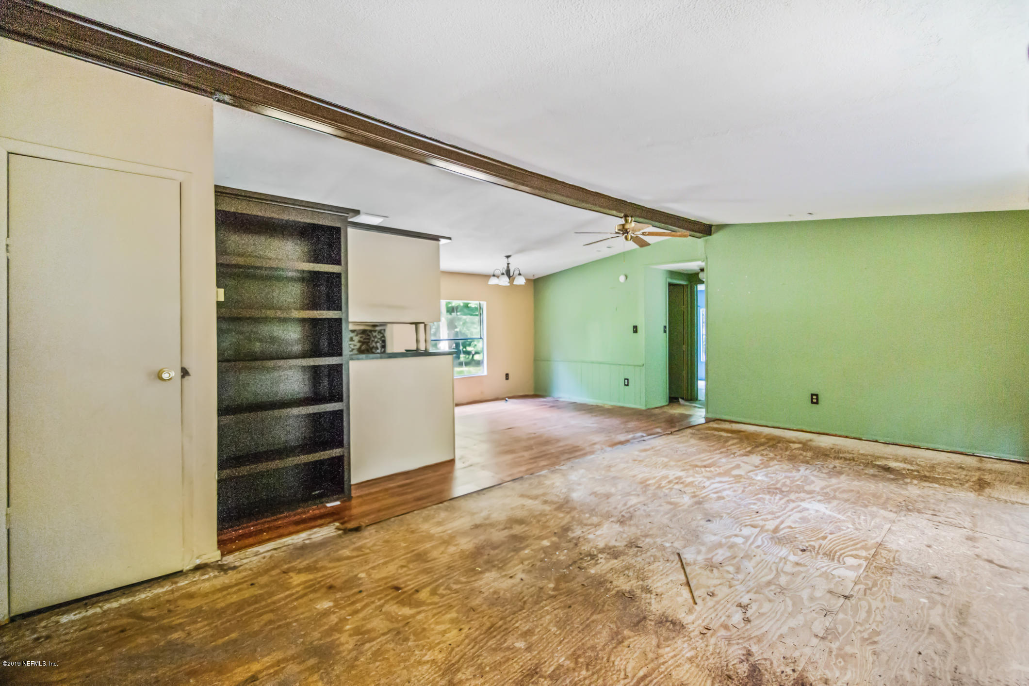 135 Buckner Road Middleburg, FL 32068 - Photo 11 of 27 a view of empty room with a window and cabinet