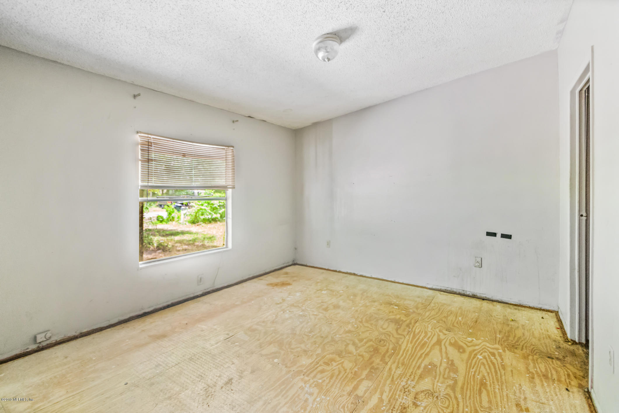 135 Buckner Road Middleburg, FL 32068 - Photo 13 of 27 a view of an empty room and window