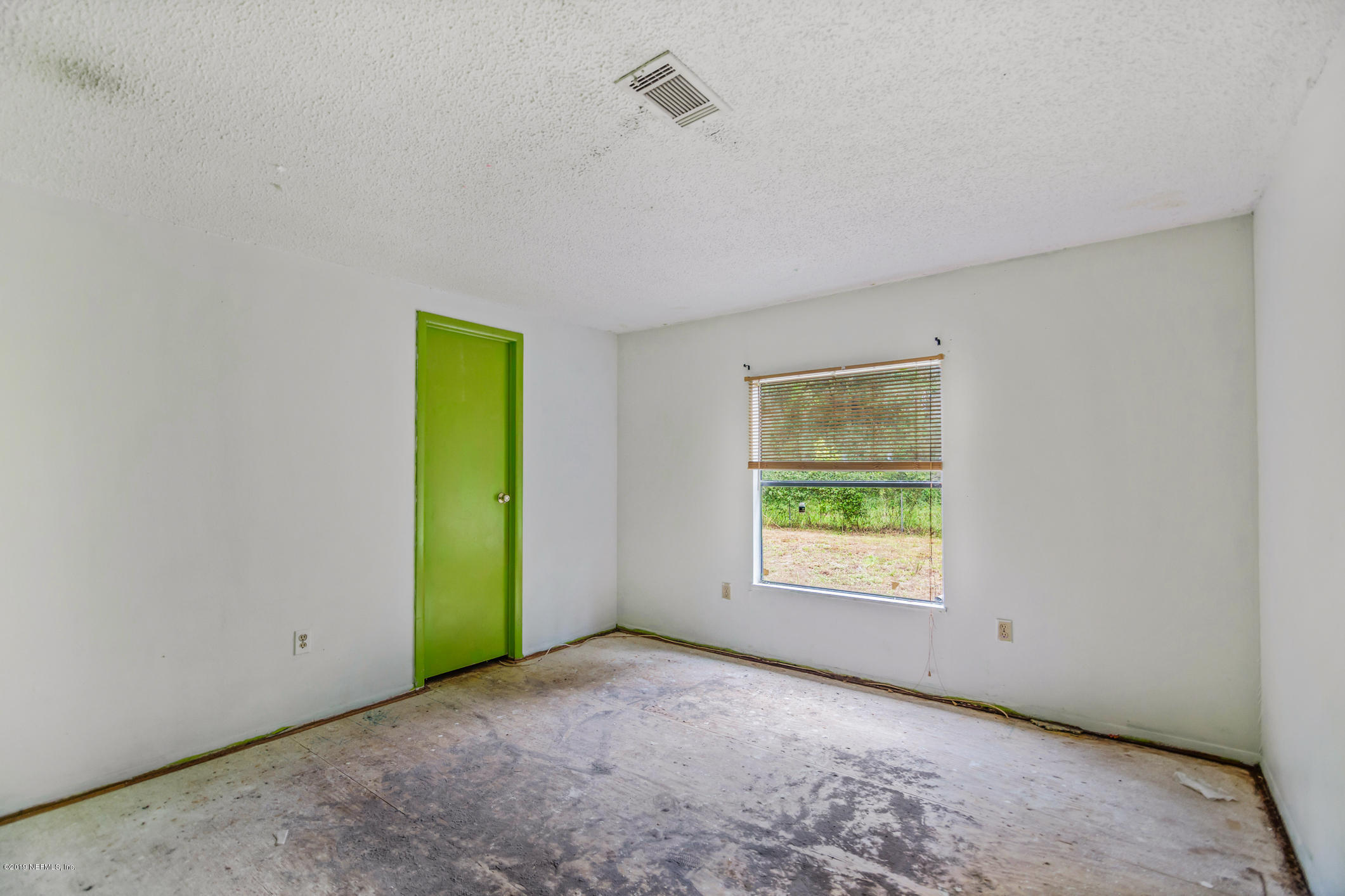 135 Buckner Road Middleburg, FL 32068 - Photo 16 of 27 a view of an empty room with a window