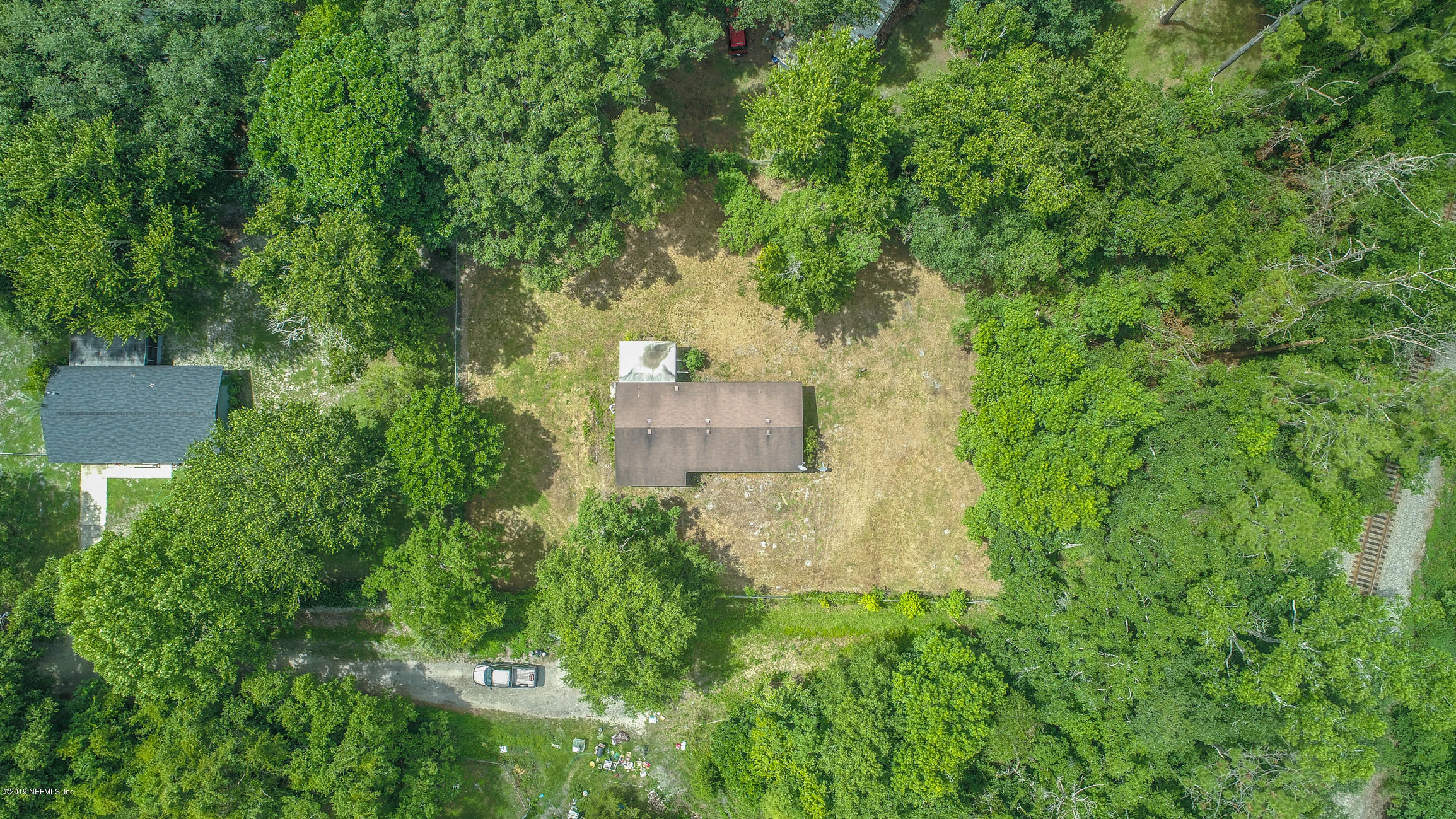 135 Buckner Road Middleburg, FL 32068 - Photo 2 of 27 an aerial view of a house with a yard
