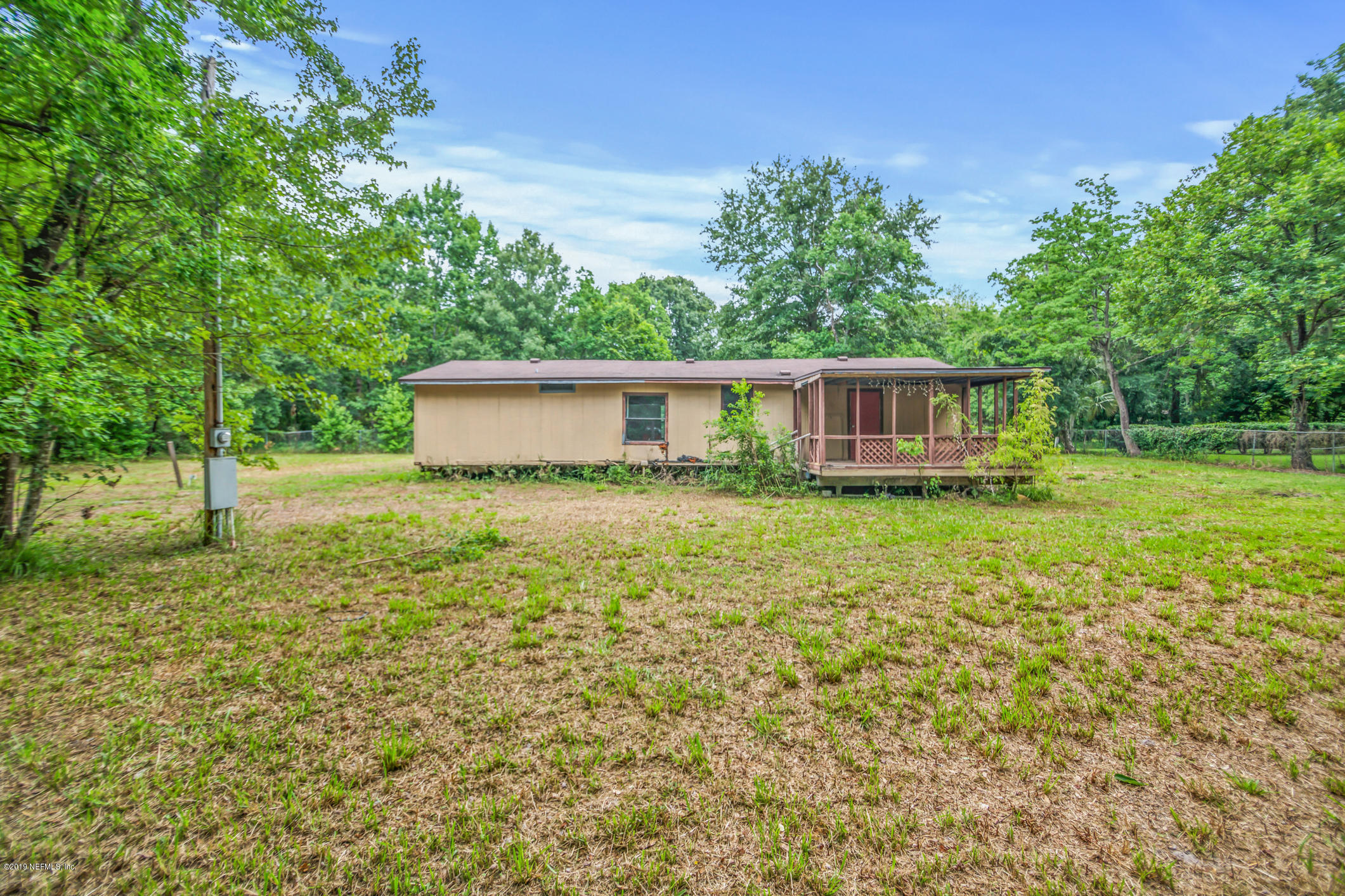 135 Buckner Road Middleburg, FL 32068 - Photo 24 of 27 a house view with a garden space