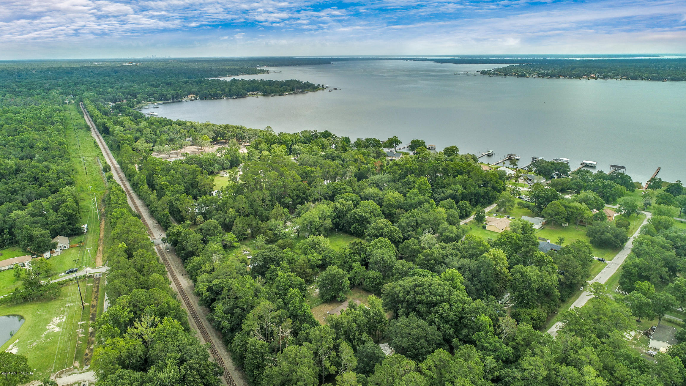 135 Buckner Road Middleburg, FL 32068 - Photo 3 of 27 a view of a lake with a yard