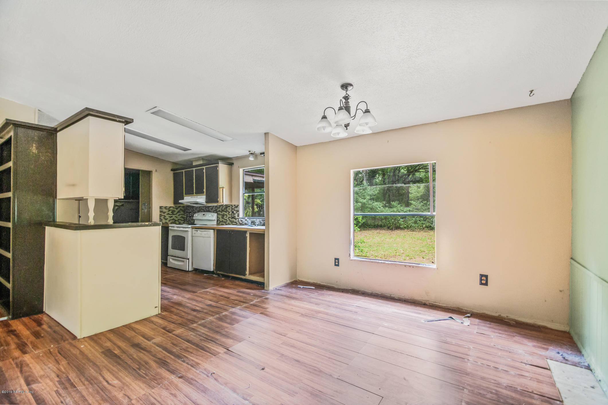 135 Buckner Road Middleburg, FL 32068 - Photo 6 of 27 a view of a kitchen with a sink a refrigerator and window