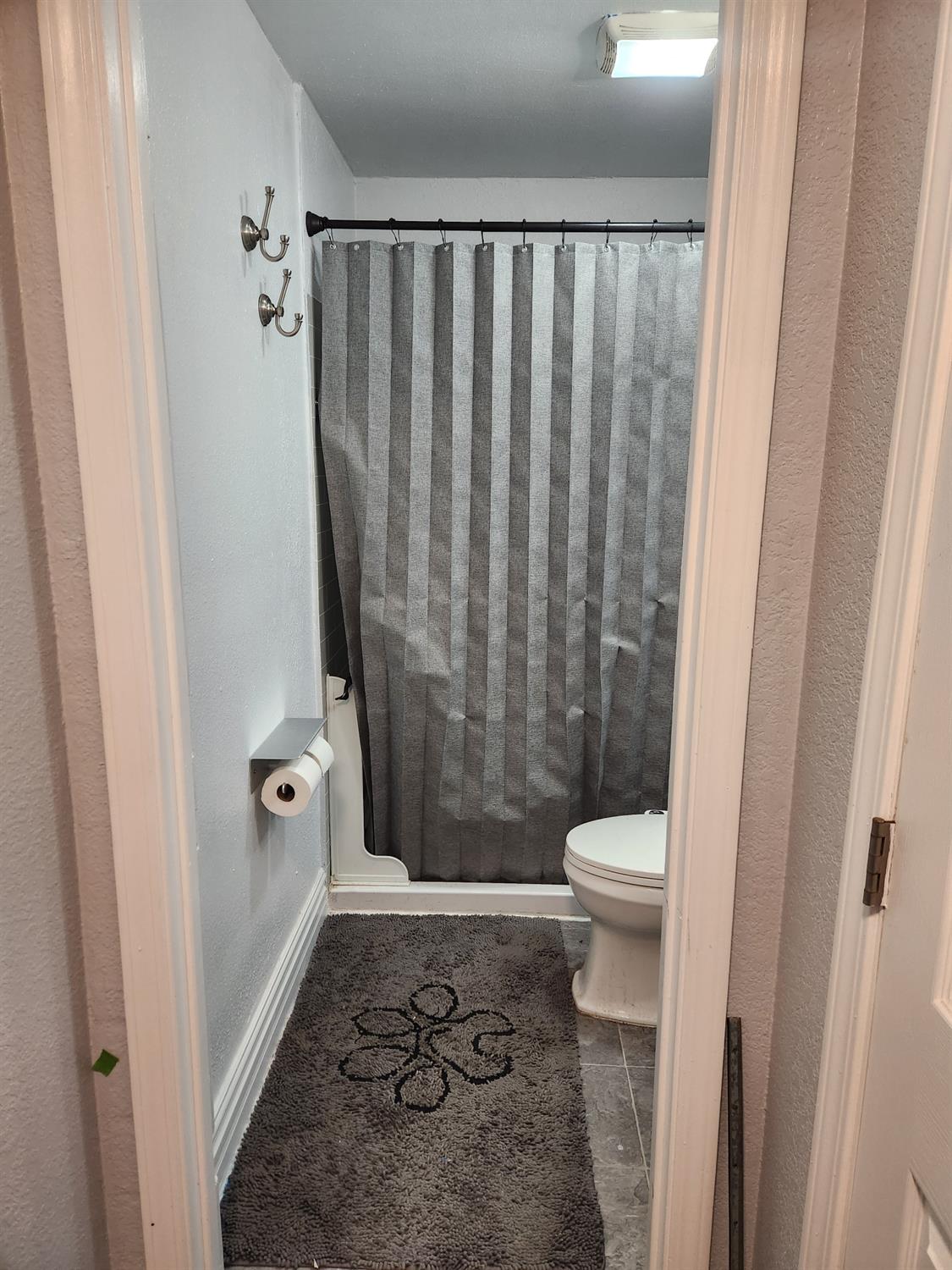 994 Fleda Avenue Olivehurst, CA 95961 - Photo 12 of 20 a bathroom with a granite countertop shower and a toilet