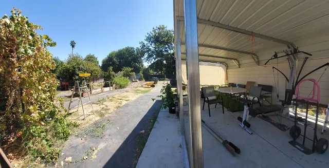 a view of a backyard with large trees