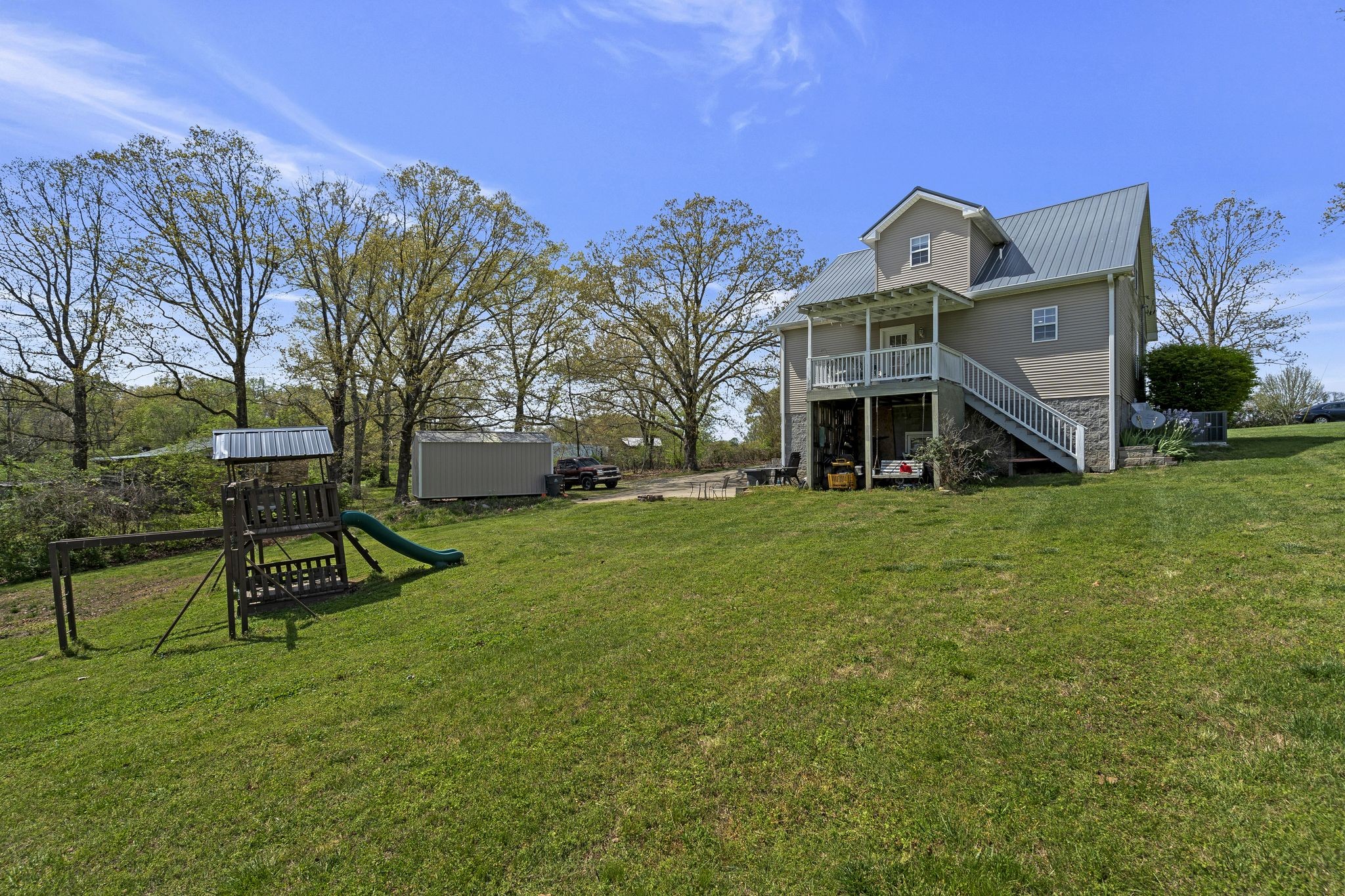 980 Hoover Road Burns, TN 37029 - Photo 30 of 33 a front view of house with yard and green space