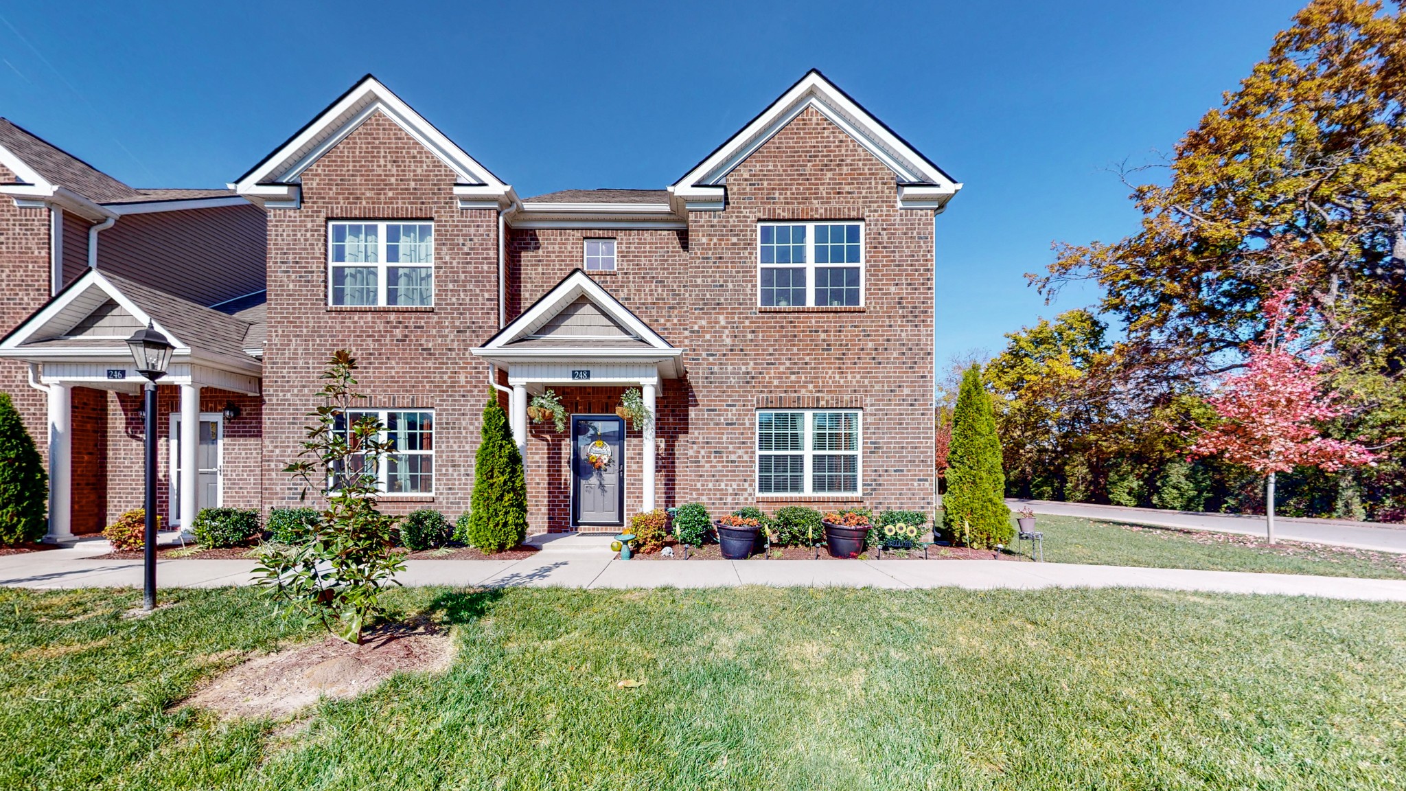 a front view of a house with a yard