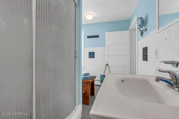 a bathroom with a tub and a sink