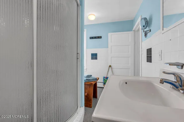 a bathroom with a tub and a sink