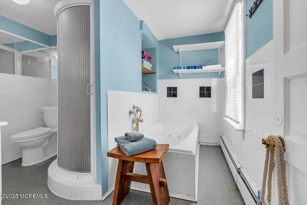 a bathroom with a toilet and a sink