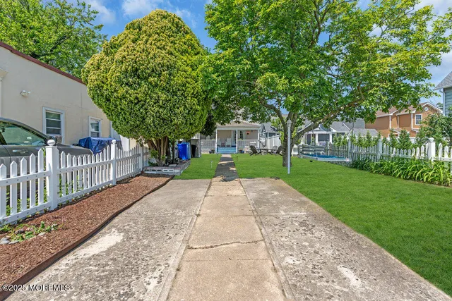 a view of a park with large trees