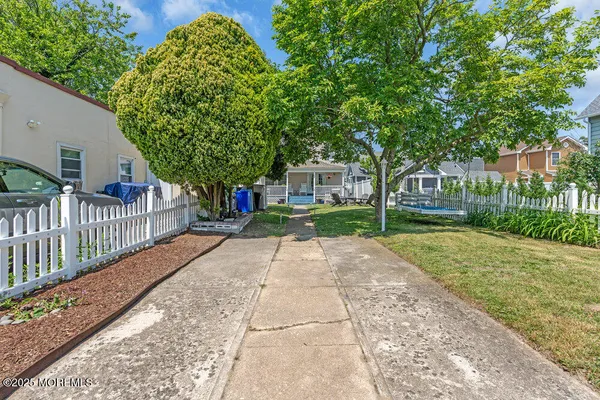 a view of a park with large trees