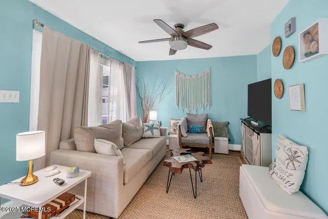 a living room with furniture and a flat screen tv