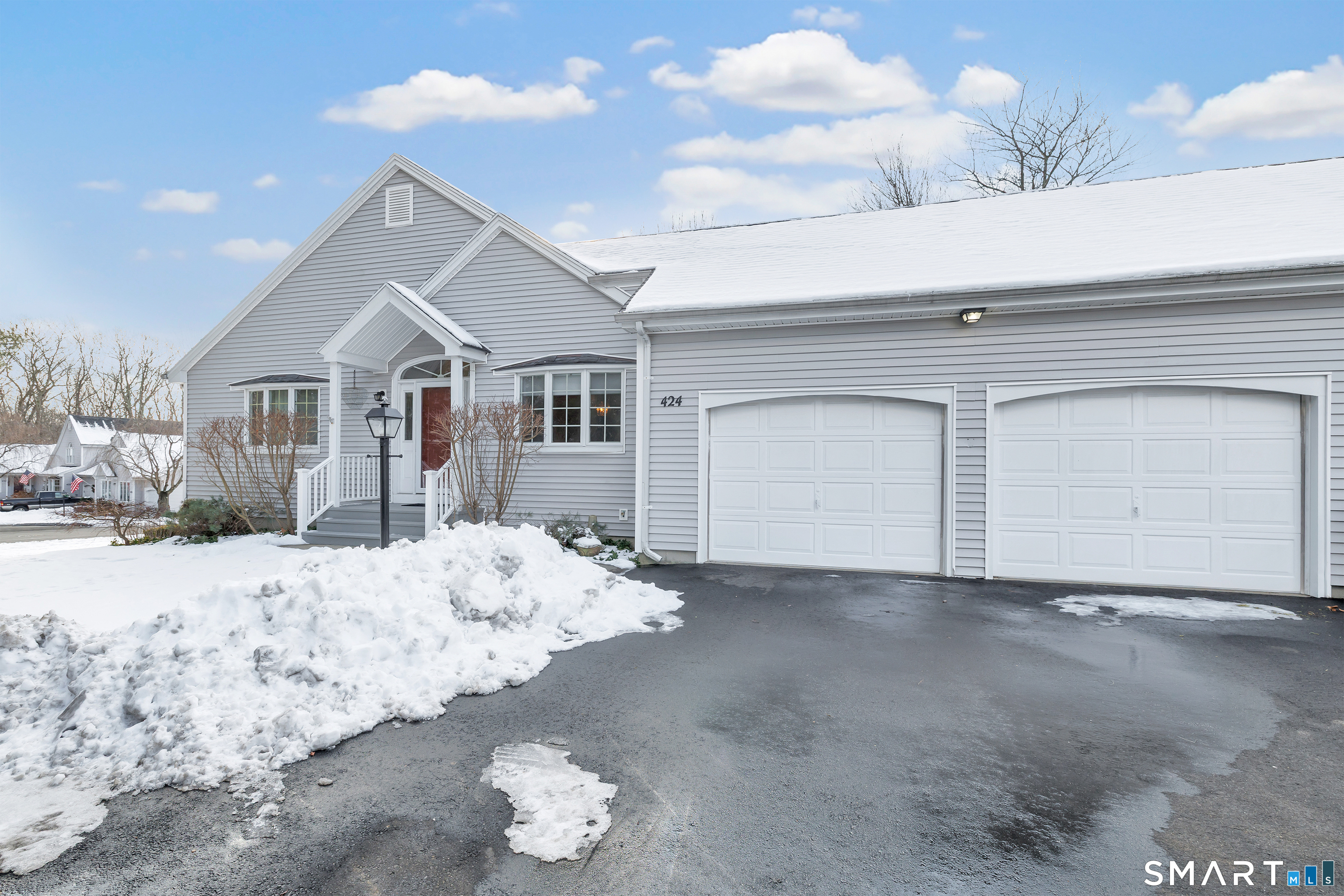 424 Navajo Loop, Unit 424 Shelton, CT 06484 - Photo 1 of 1 a view of a house with a snow in the background