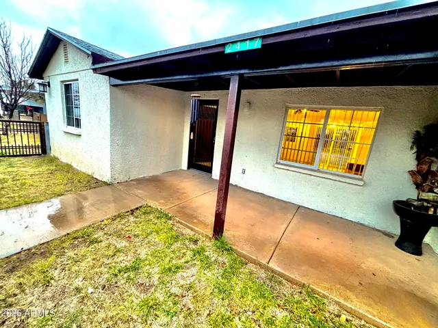 a view of a backyard of a house