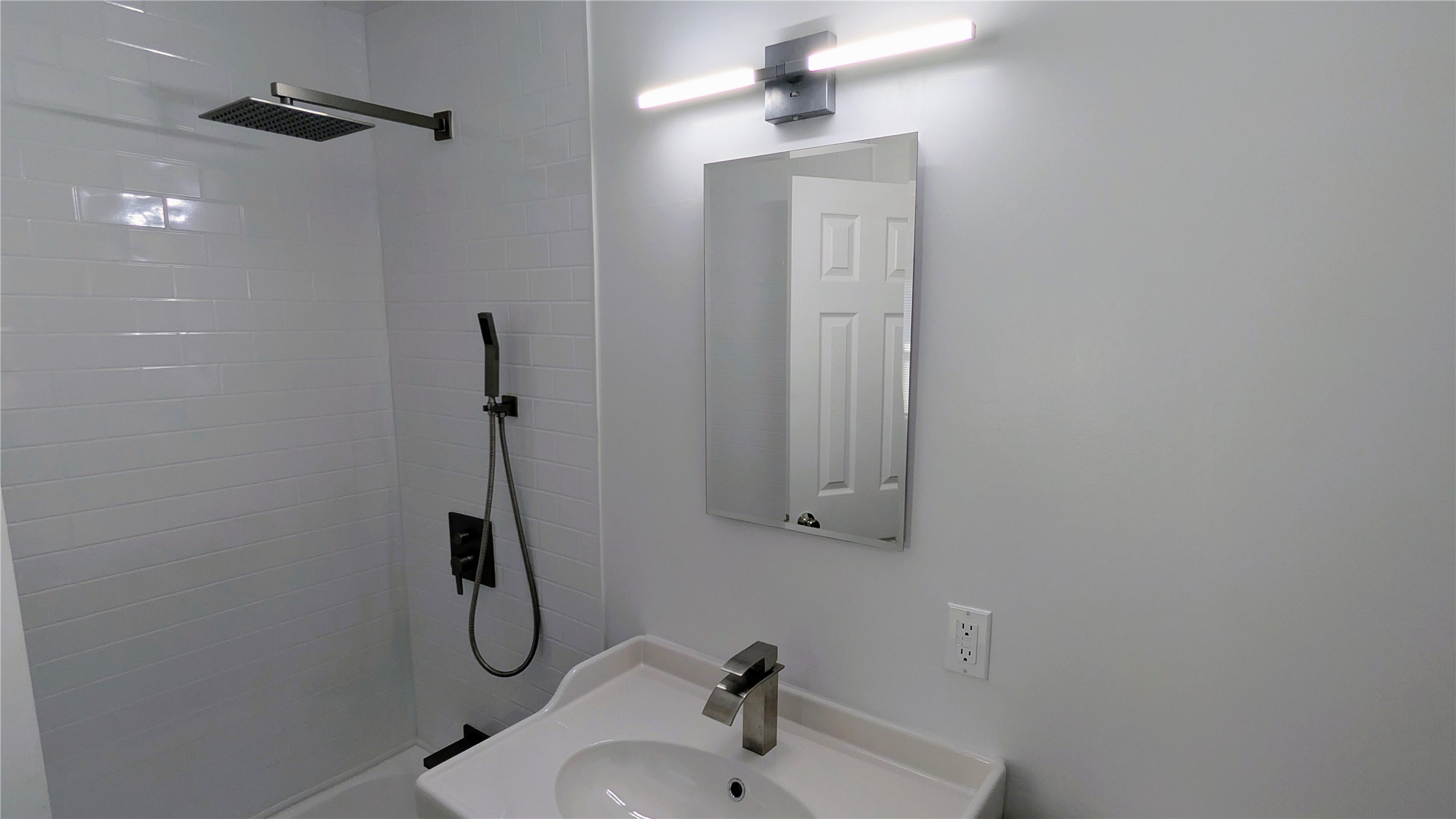 4122 Botany Lane Houston, TX 77047 - Photo 16 of 24 a bathroom with a sink and mirror