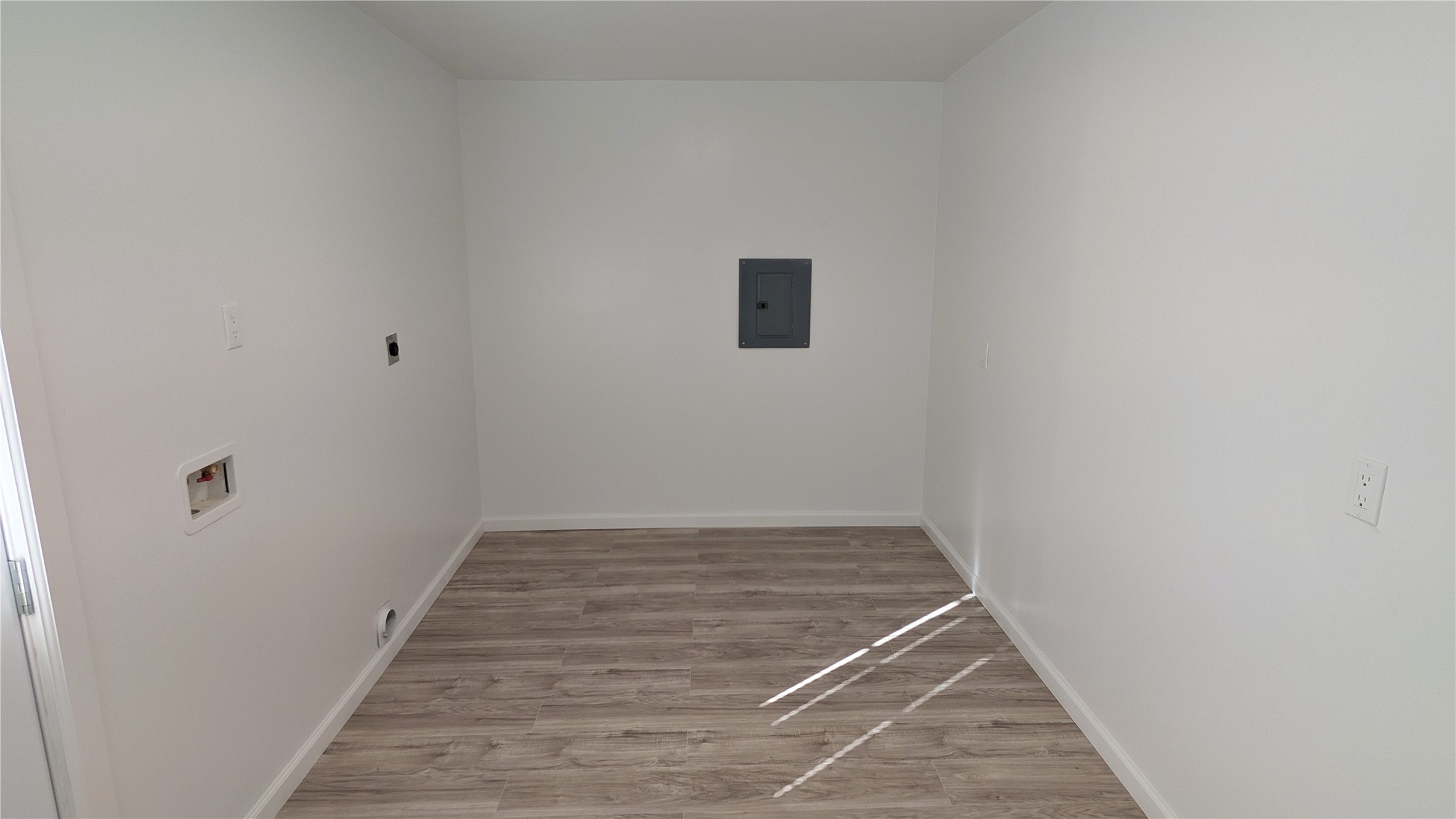 4122 Botany Lane Houston, TX 77047 - Photo 19 of 24 a view of a hallway with wooden floor