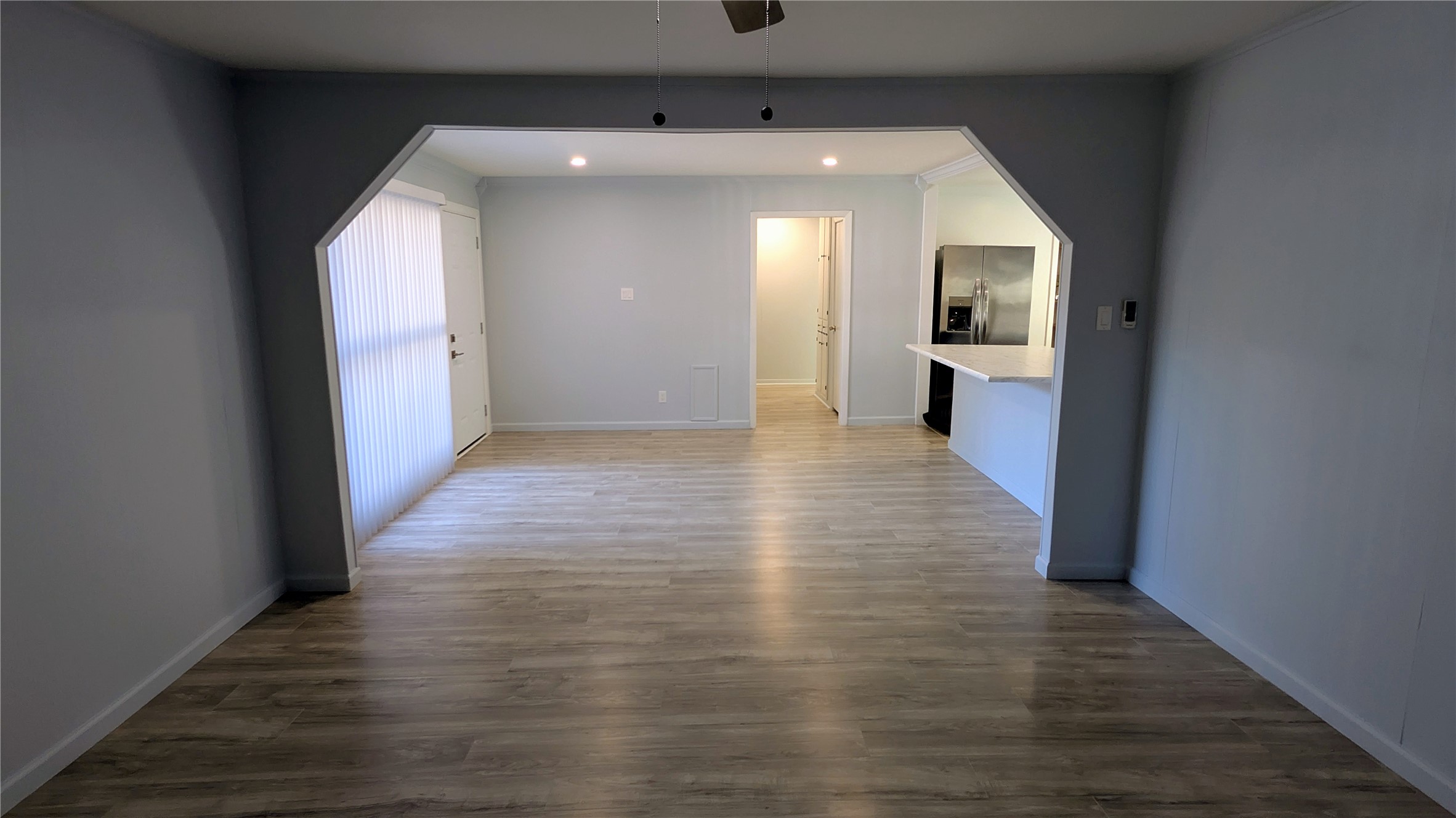4122 Botany Lane Houston, TX 77047 - Photo 4 of 24 a view of a hallway view with wooden floor and staircase