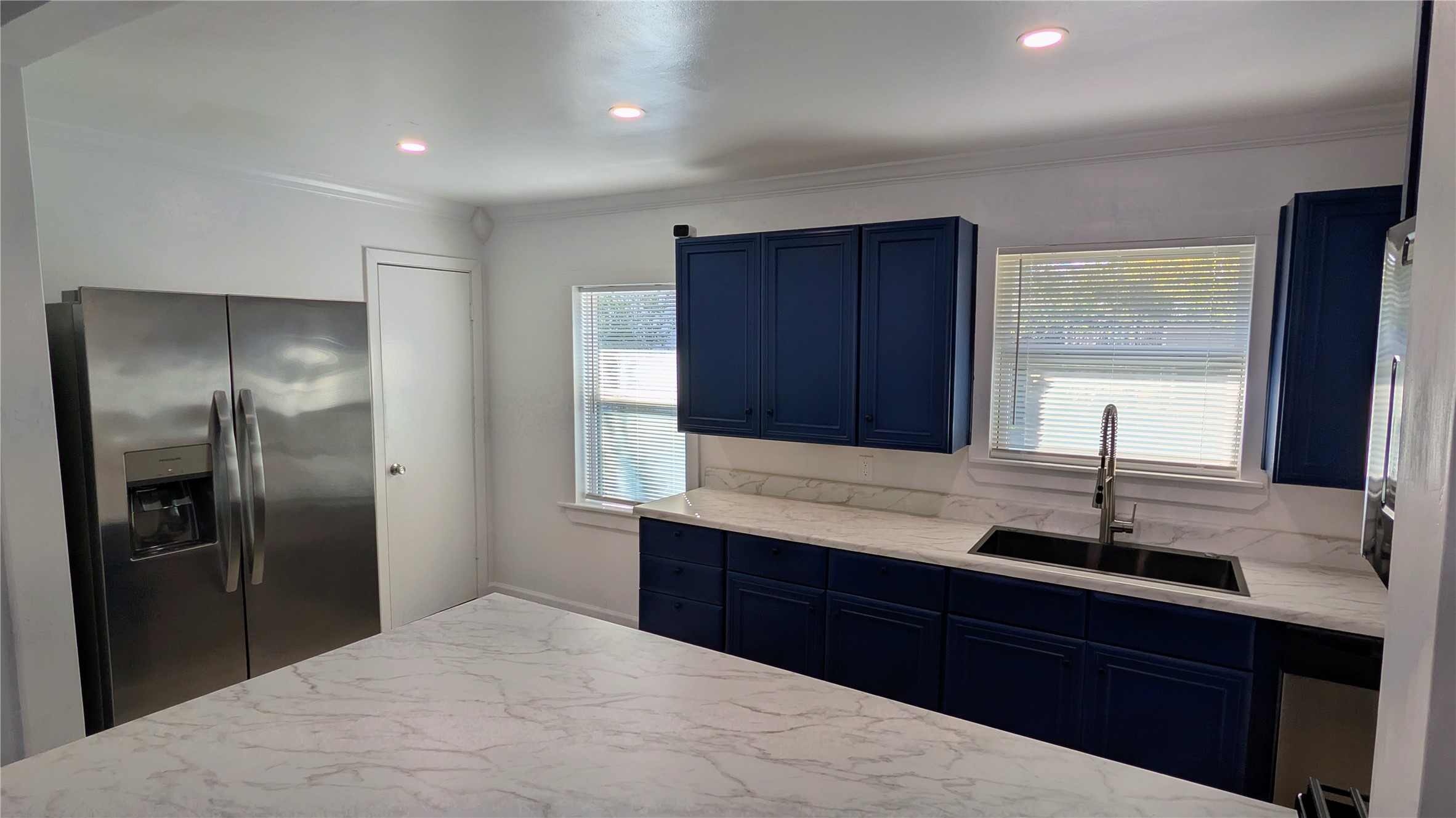 4122 Botany Lane Houston, TX 77047 - Photo 6 of 24 a kitchen with stainless steel appliances granite countertop a refrigerator and a sink