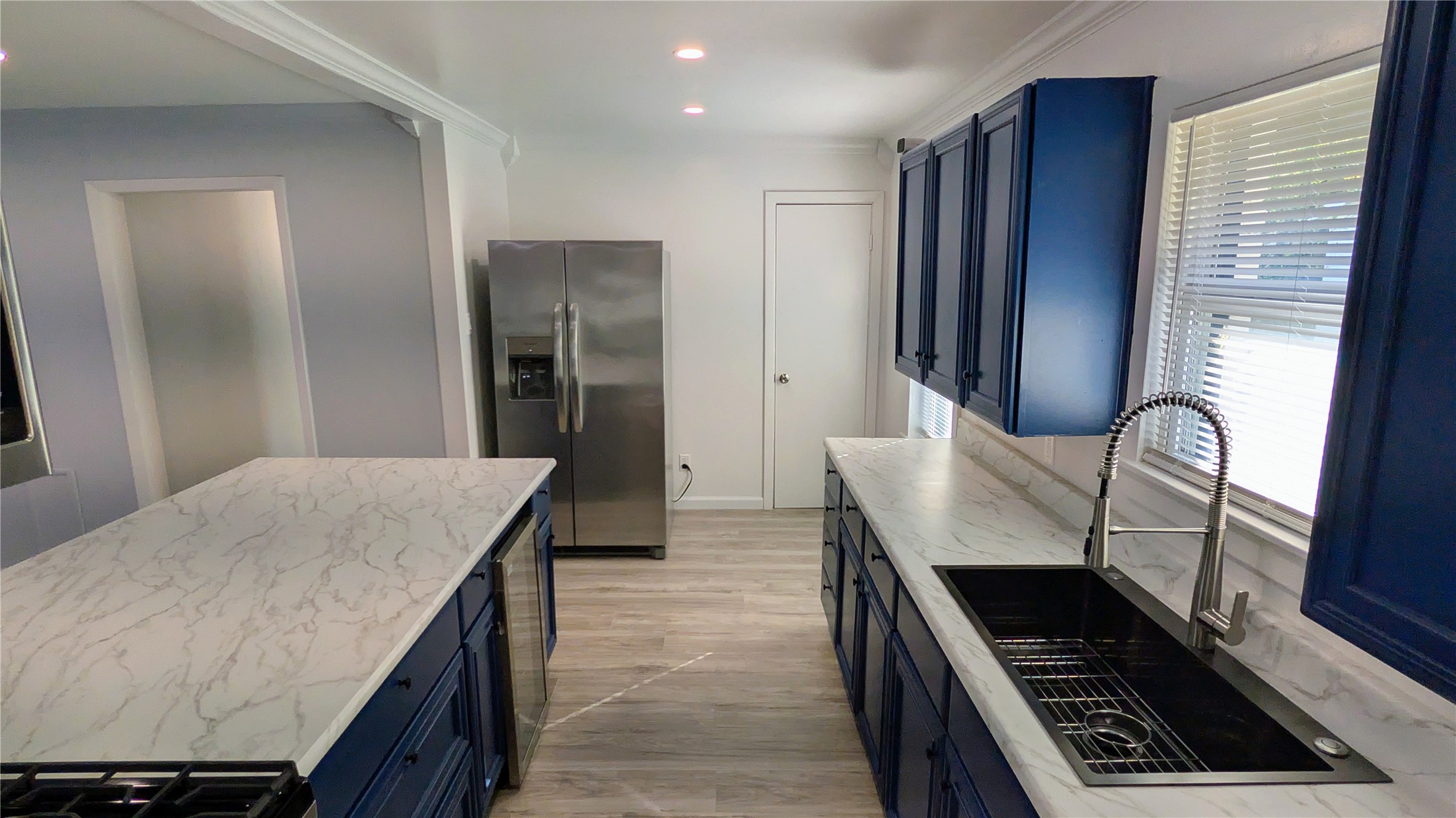 4122 Botany Lane Houston, TX 77047 - Photo 7 of 24 a kitchen with sink and refrigerator