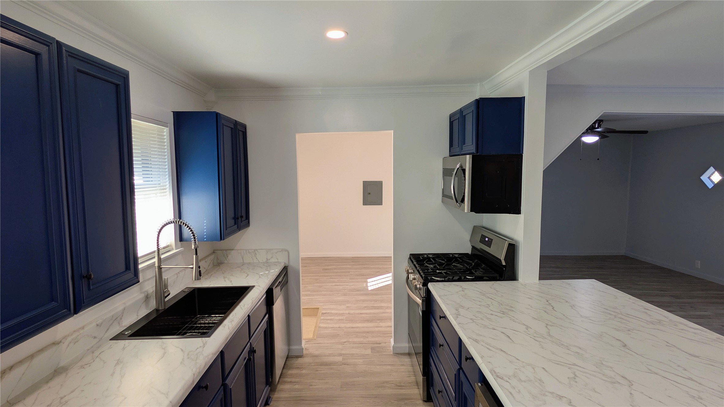 4122 Botany Lane Houston, TX 77047 - Photo 8 of 24 a kitchen with a refrigerator and a stove top oven