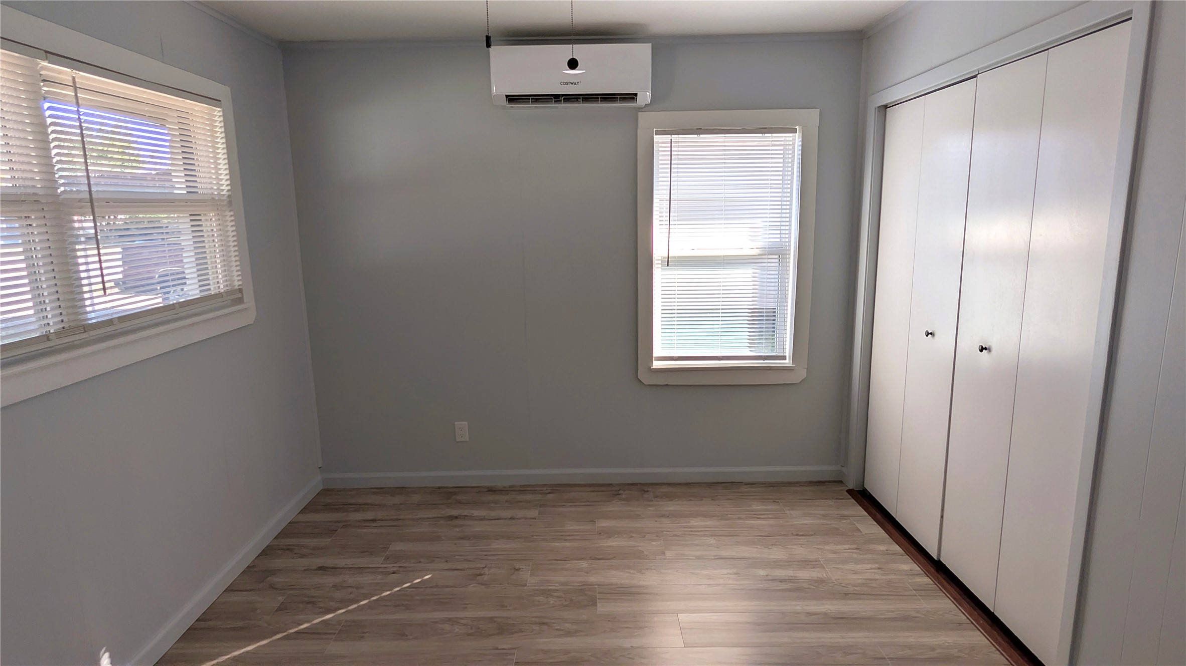 4122 Botany Lane Houston, TX 77047 - Photo 10 of 24 a view of an empty room with wooden floor and a window