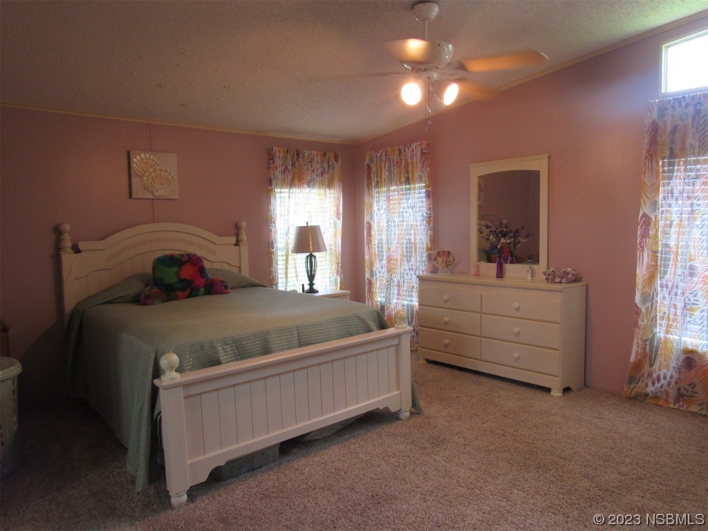 4347 Cedar Way Edgewater, FL 32141 - Photo 17 of 32 a bedroom with a bed and window