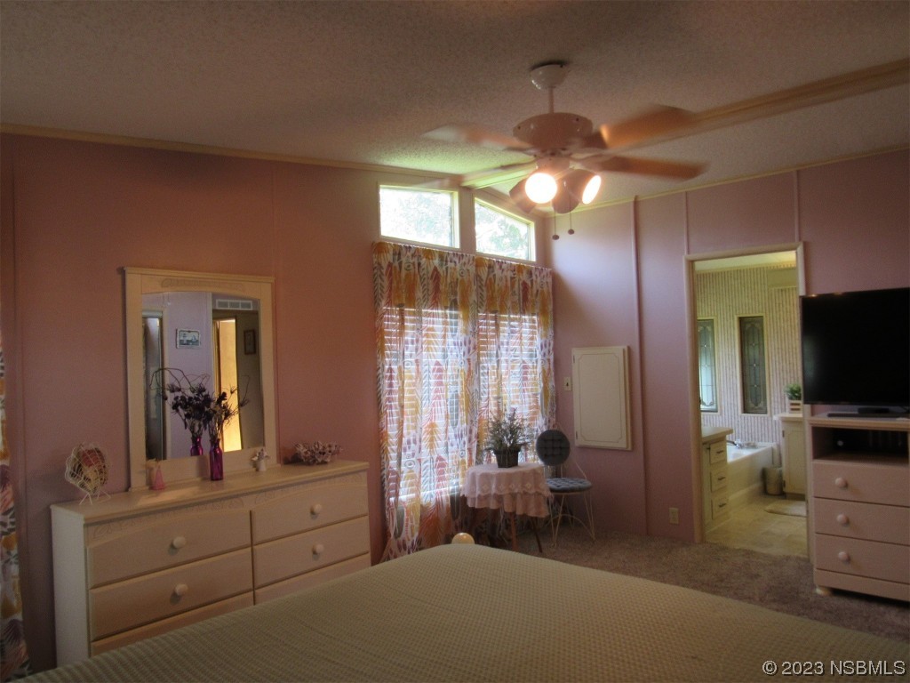 4347 Cedar Way Edgewater, FL 32141 - Photo 18 of 32 a living room with furniture and a flat screen tv