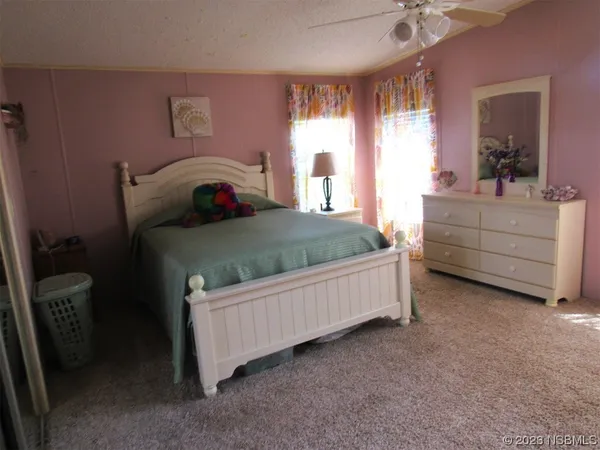 a bed room with a bed and a dresser