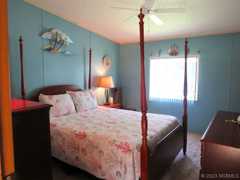 4347 Cedar Way Edgewater, FL 32141 - Photo 26 of 32 a bedroom with bed and window