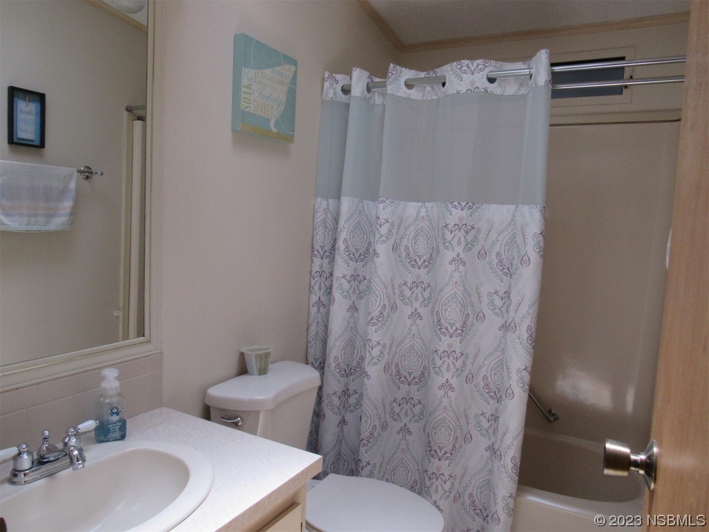 4347 Cedar Way Edgewater, FL 32141 - Photo 27 of 32 a bathroom with a sink toilet and shower