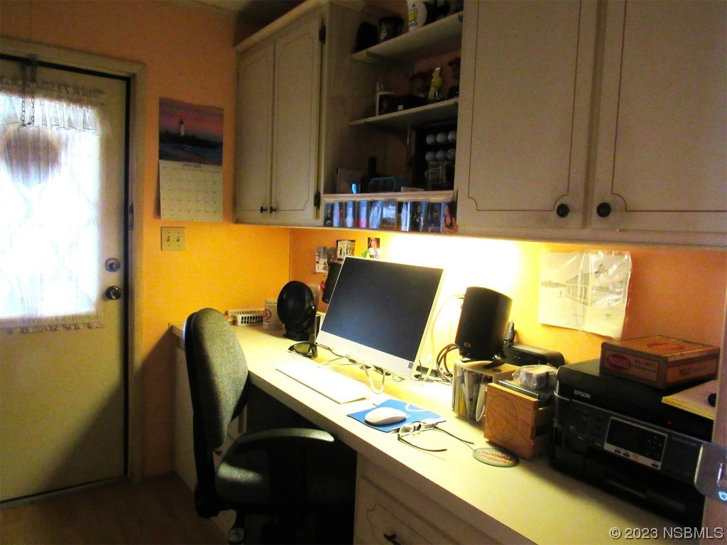 4347 Cedar Way Edgewater, FL 32141 - Photo 30 of 32 a view of a workspace with furniture and a window