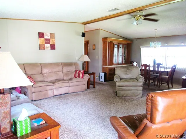 a living room with furniture and window
