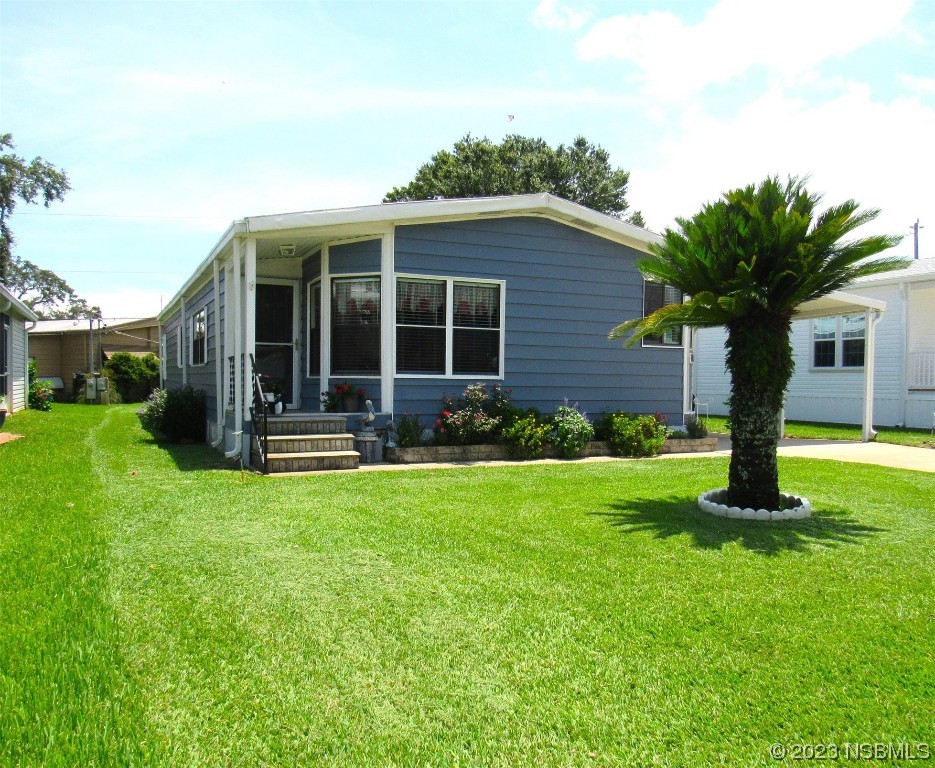 4347 Cedar Way Edgewater, FL 32141 - Photo 32 of 32 a front view of house with yard and garage