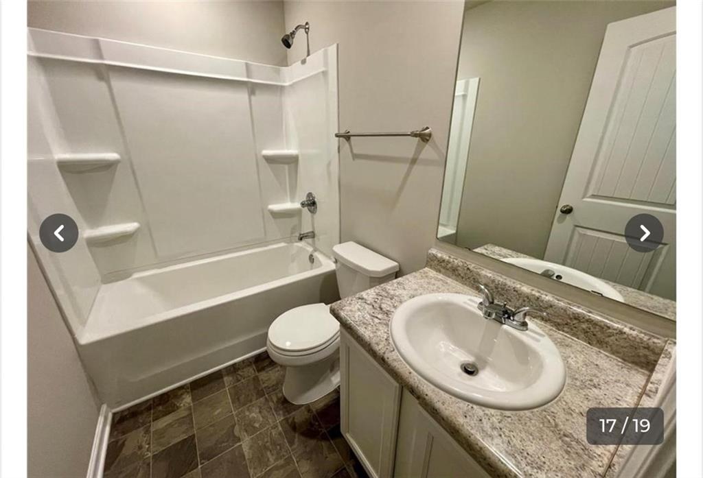 219 Turner Lane Woodstock, GA 30188 - Photo 13 of 15 a bathroom with a sink toilet and shower