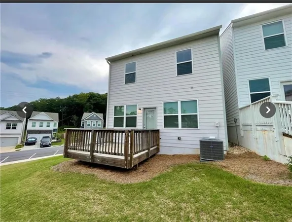 a view of backyard with deck and deck