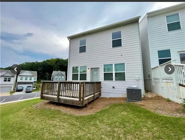 a view of backyard with deck and deck