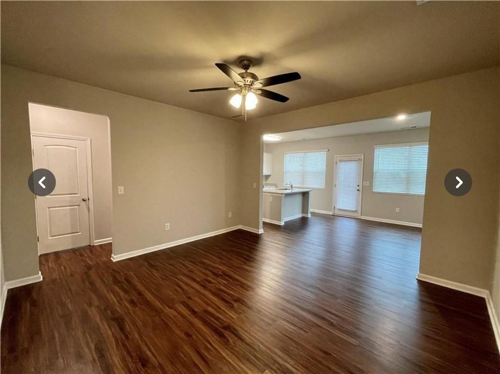 219 Turner Lane Woodstock, GA 30188 - Photo 2 of 15 a view of an empty room with window and wooden floor