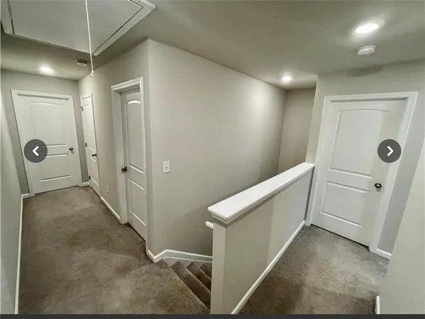 a view of a hallway with closet