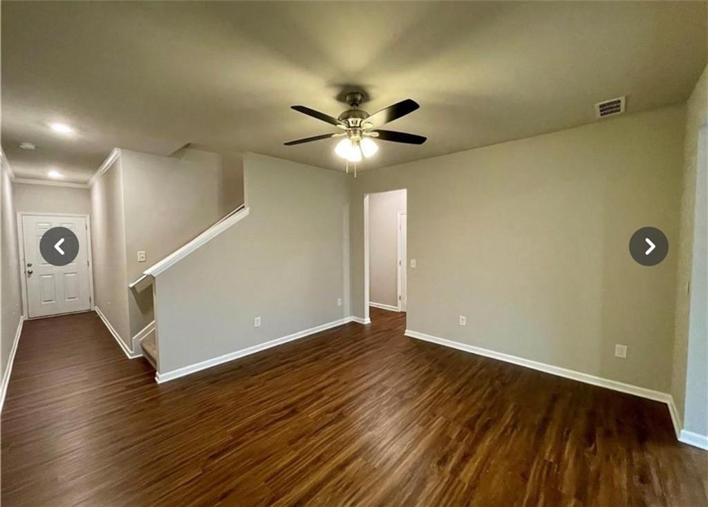 219 Turner Lane Woodstock, GA 30188 - Photo 6 of 15 a view of an empty room with wooden floor