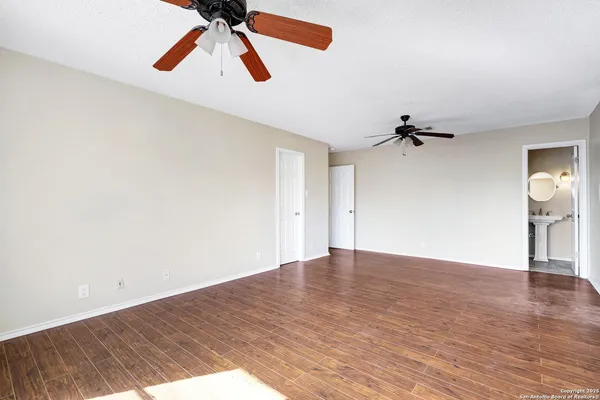 a bathroom with a sink a mirror and a toilet