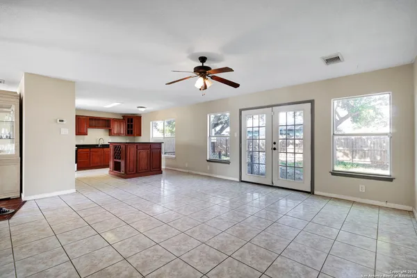 a open kitchen with stainless steel appliances granite countertop a refrigerator and a sink