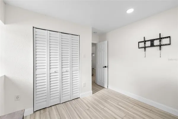 a bedroom with a bed and a desk