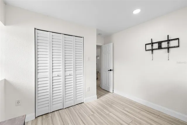 a bedroom with a bed and a desk