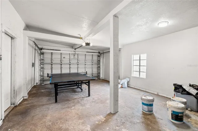 a workspace with furniture and white walls