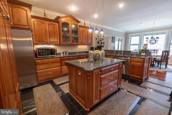 a living room with furniture a window and a fireplace